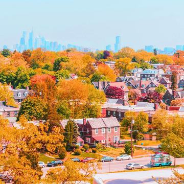 Fall treeline view of Philadelphia neighborhood near Saint Joseph's University looking at the Philadelphia skyline.
