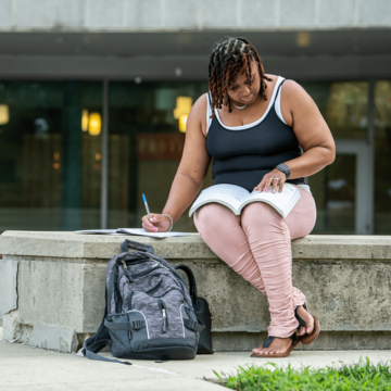 Adult student outside Post Learning Commons