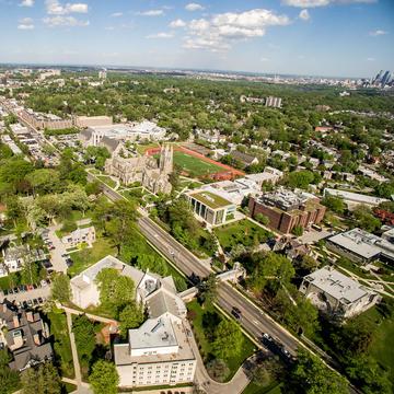 Aerial view of Saint Joseph's University campus with Philadelphia skyline in the background