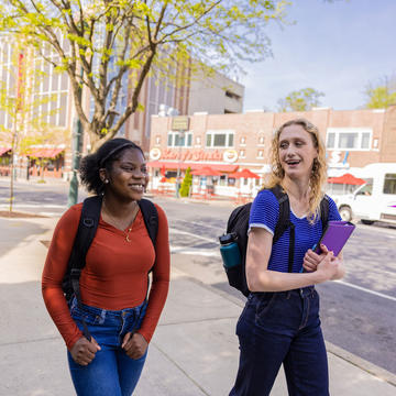two saint joseph's university students walking outside campus