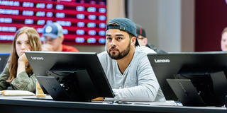 male student in the saint joseph's university wall street trading room