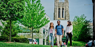 Students at Saint Joseph's University walking in front of the Drexel Library
