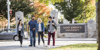 Saint Joseph's University Students crossing City Ave in Philadelphia, PA