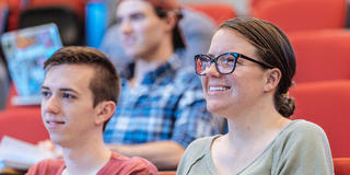 female saint joseph's university student inside a lecture hall