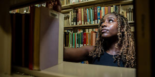 A student searches for a book at the library