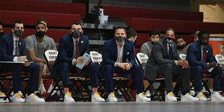 Saint Joseph’s University men’s basketball coaches on the sideline wear sneakers with gold laces for Coaches Vs. Cancer.