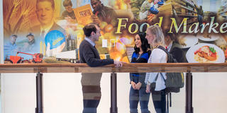 food marketing students talking to food marketing professor in mandeville hall