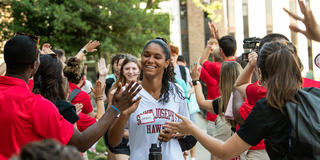 saint joseph's university first-year student giving high fives during orientation
