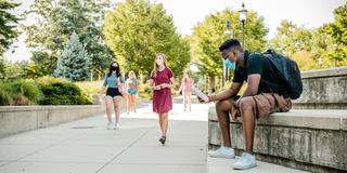 Saint Joseph's University students walking on campus practicing safe distancing