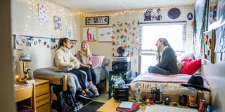 two students talking inside their dorm at saint joseph's university