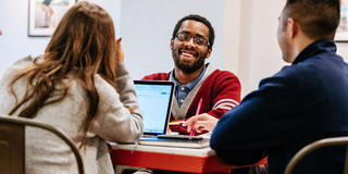 Three students talking outside of Saxby's at Saint Joseph's University