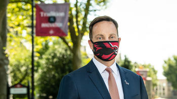 Mark C. Reed, Ed.D., wearing a mask.