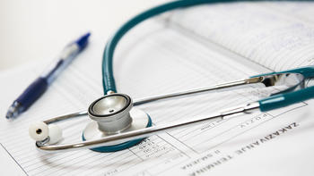 stethoscope and pen