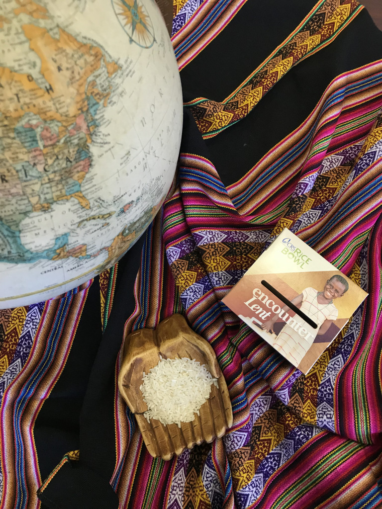 Table decorated with a globe and a bowl of rice