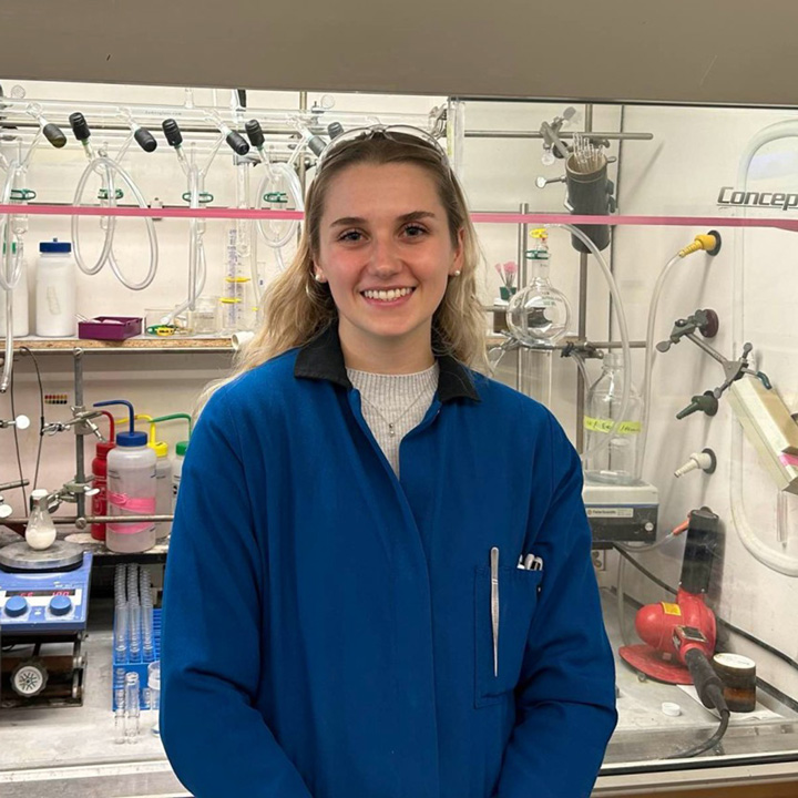Kara Moulton wearing a lab coat in a lab