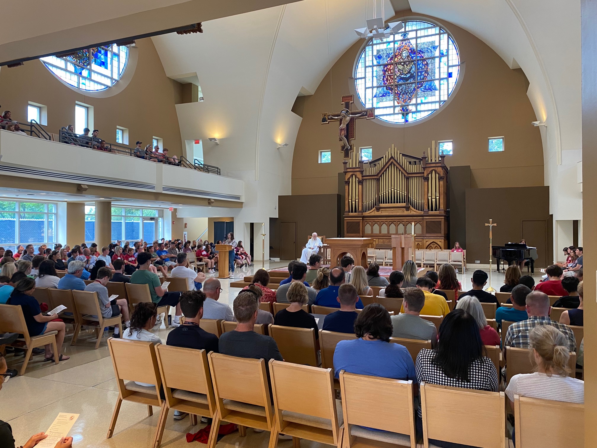 A preacher hosting a congregation at the Chapel of Saint Joseph