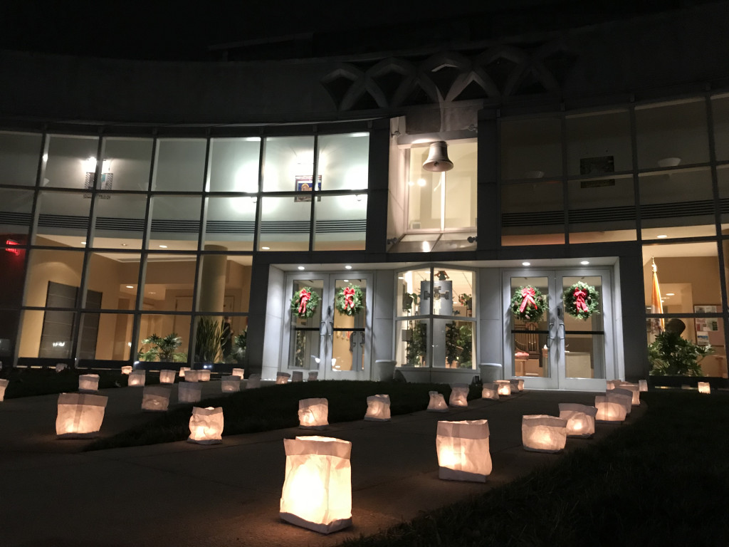 Bags lit with candles on the walkway towards Saint Joseph's chapel on Hawk Hill campus