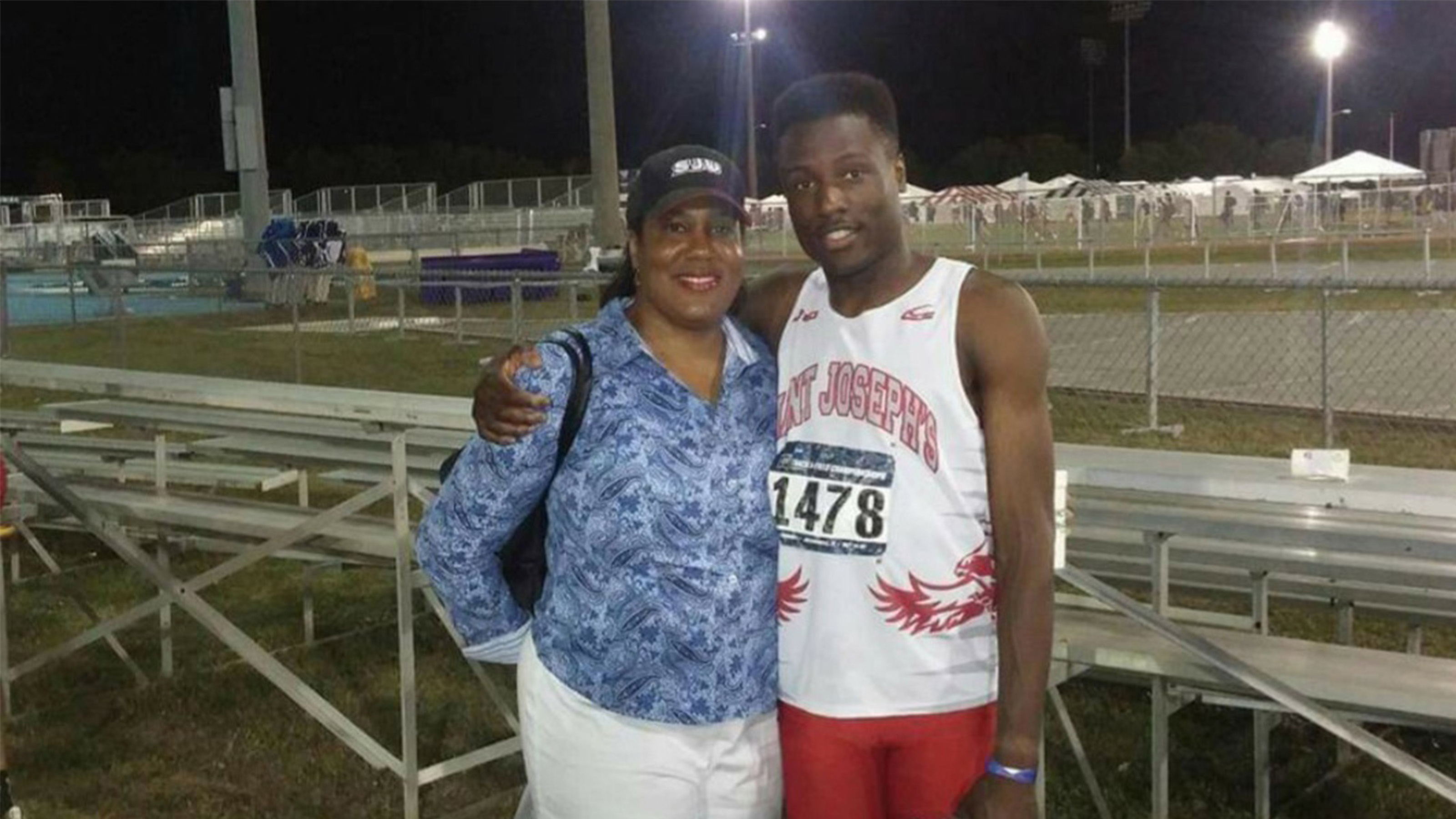 Mother and son standing at the NCAA tournament