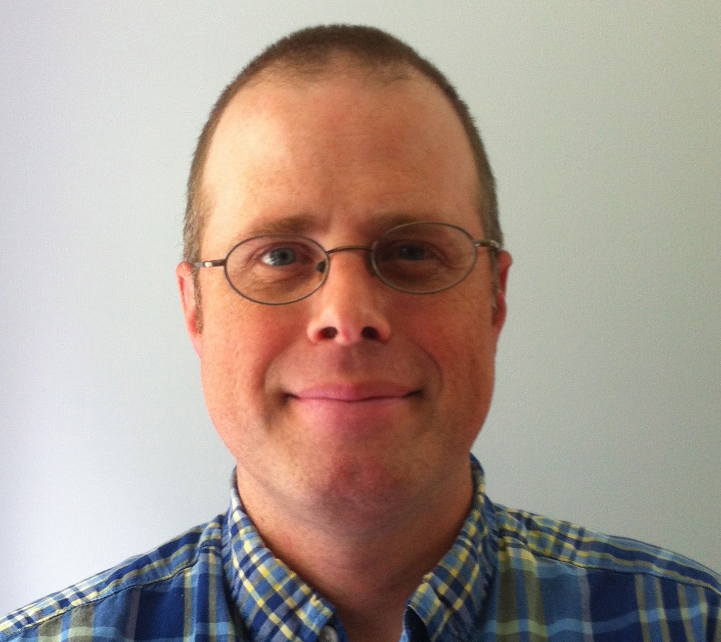 Ed Dodd, man wearing plaid shirt and glasses