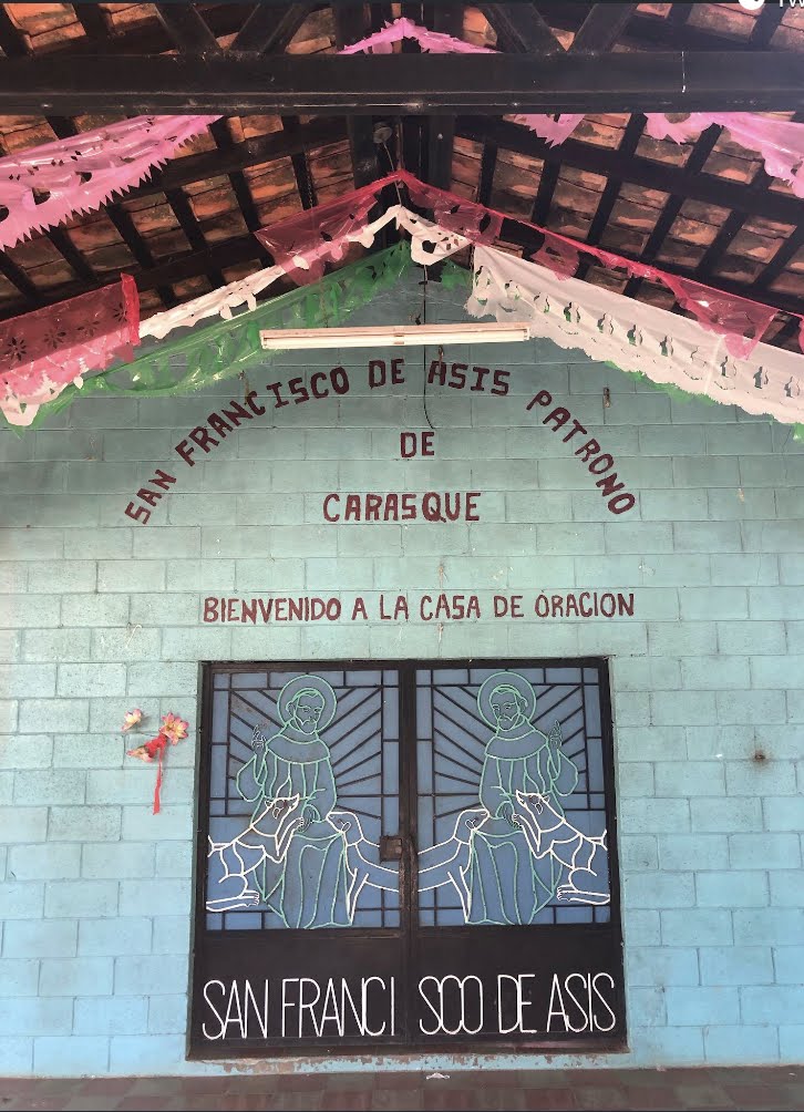 Mural on the side of a church in El Salvador