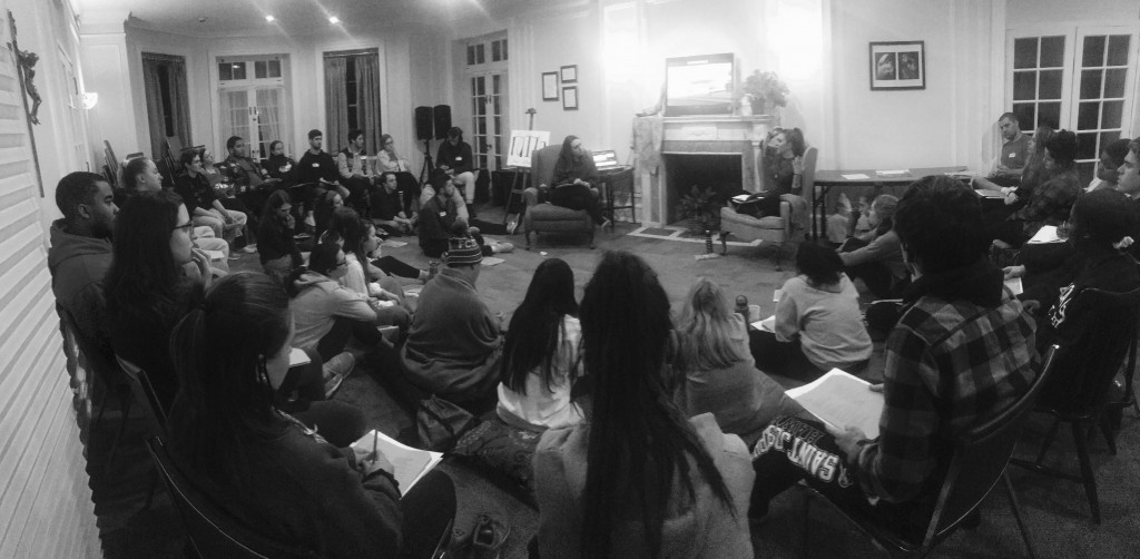 Students sitting in a comfortable living room discussing scripture