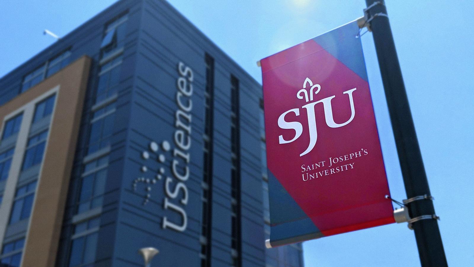 SJU banner next to USciences building