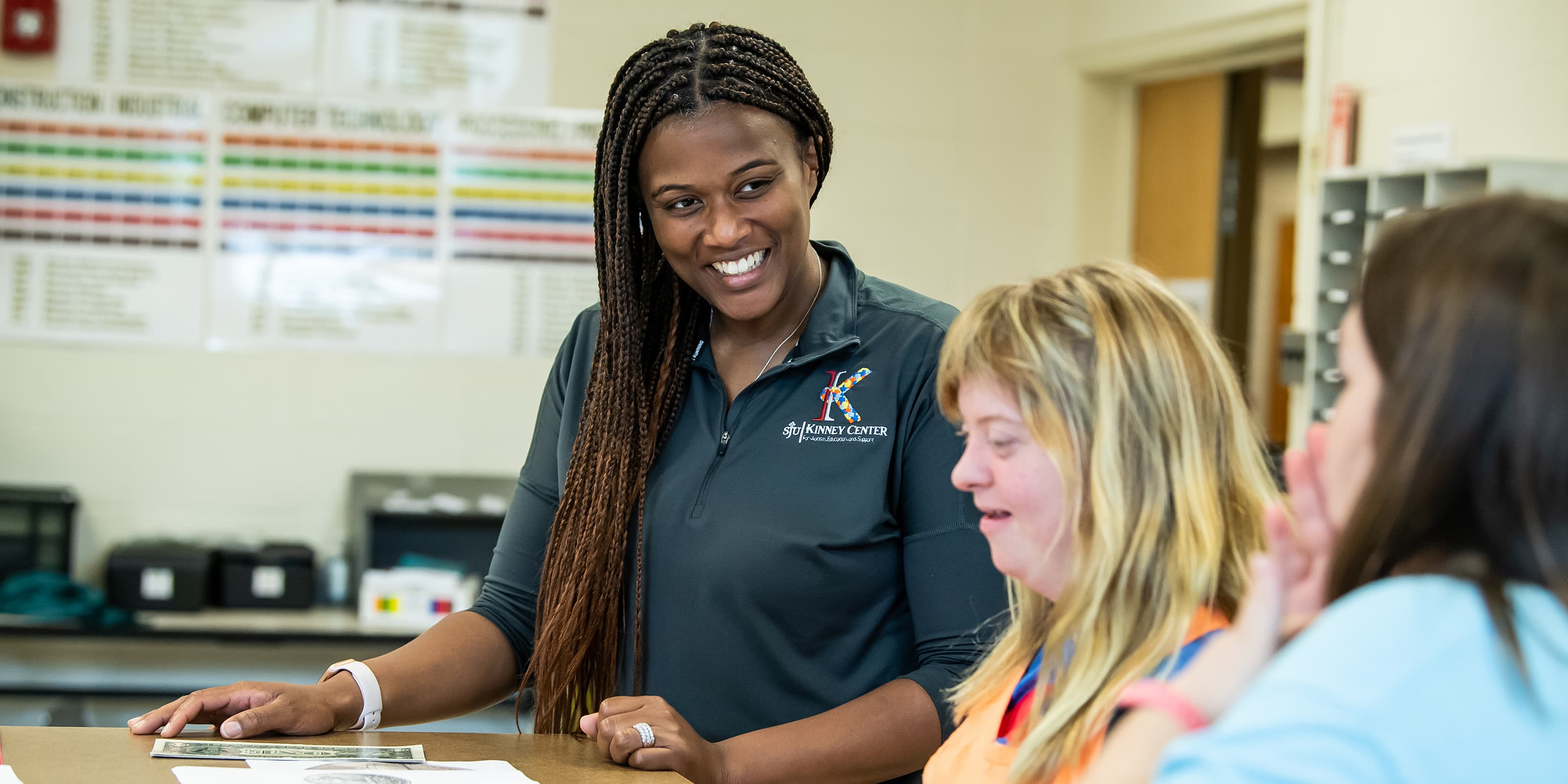 A Kinney Center staff talking to a student