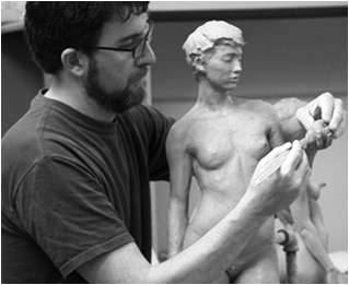 Sculptor Joshua Koffman working on a piece of art