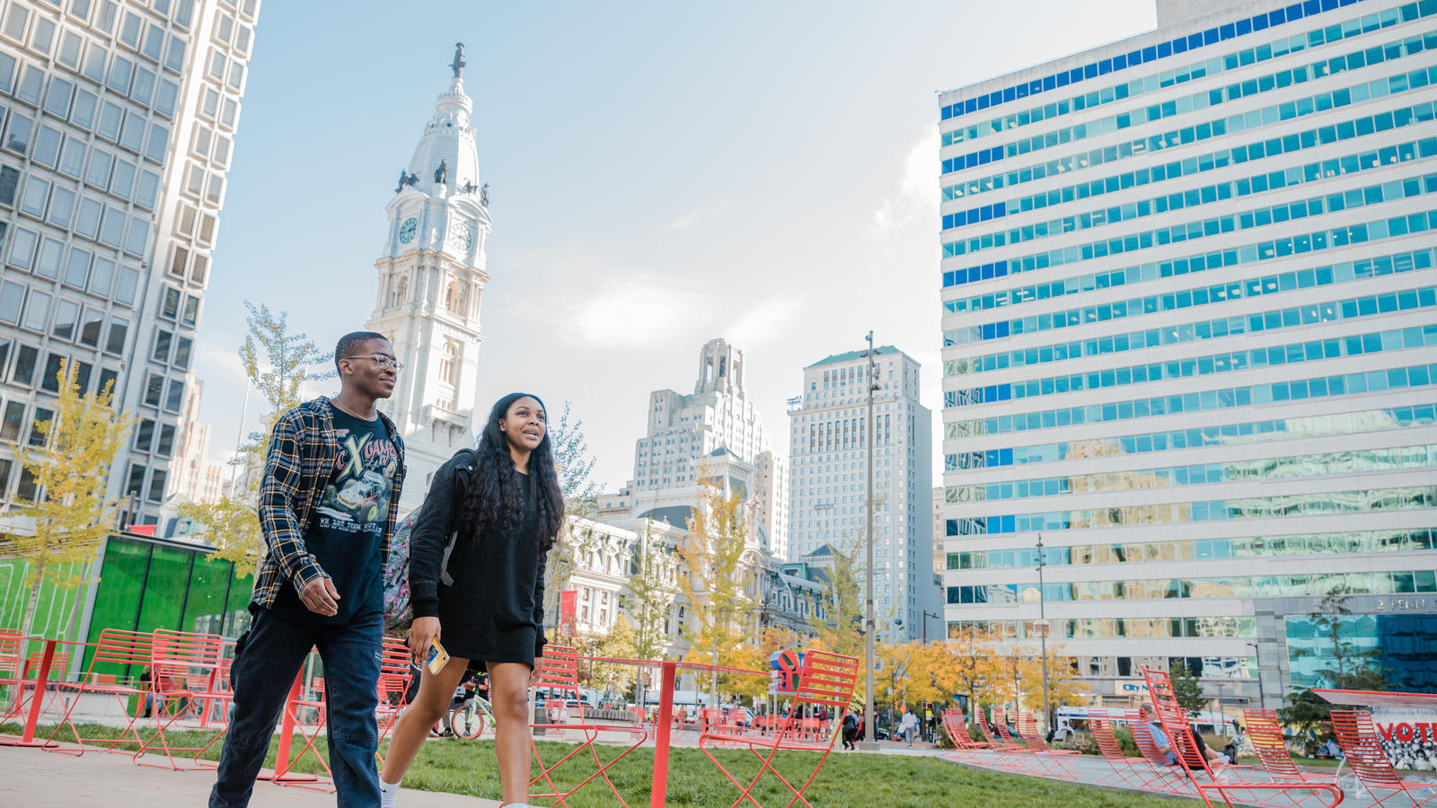 Two students walking in front of City Hall in Philadelphia