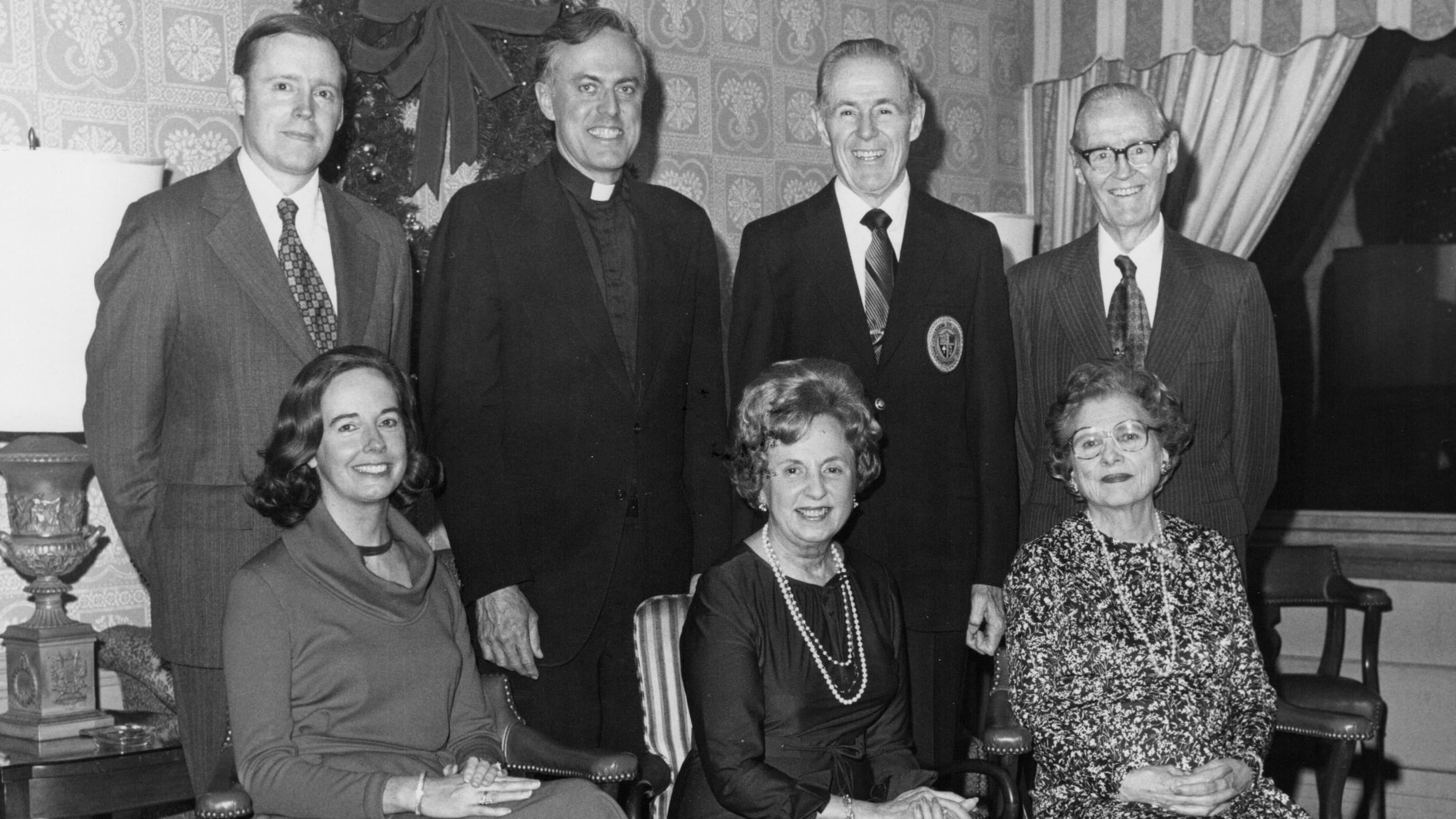Donald I. MacLean, S.J., with members of the Trainer family: Regina Trainer, Anne Trainer, Peg Trainer, William Trainer, Raymond Trainer ’25 and Clem Trainer ’22.