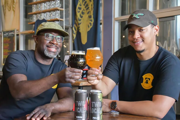 Richard Koiler ‘14 and his brother Mengistu toasting with beer