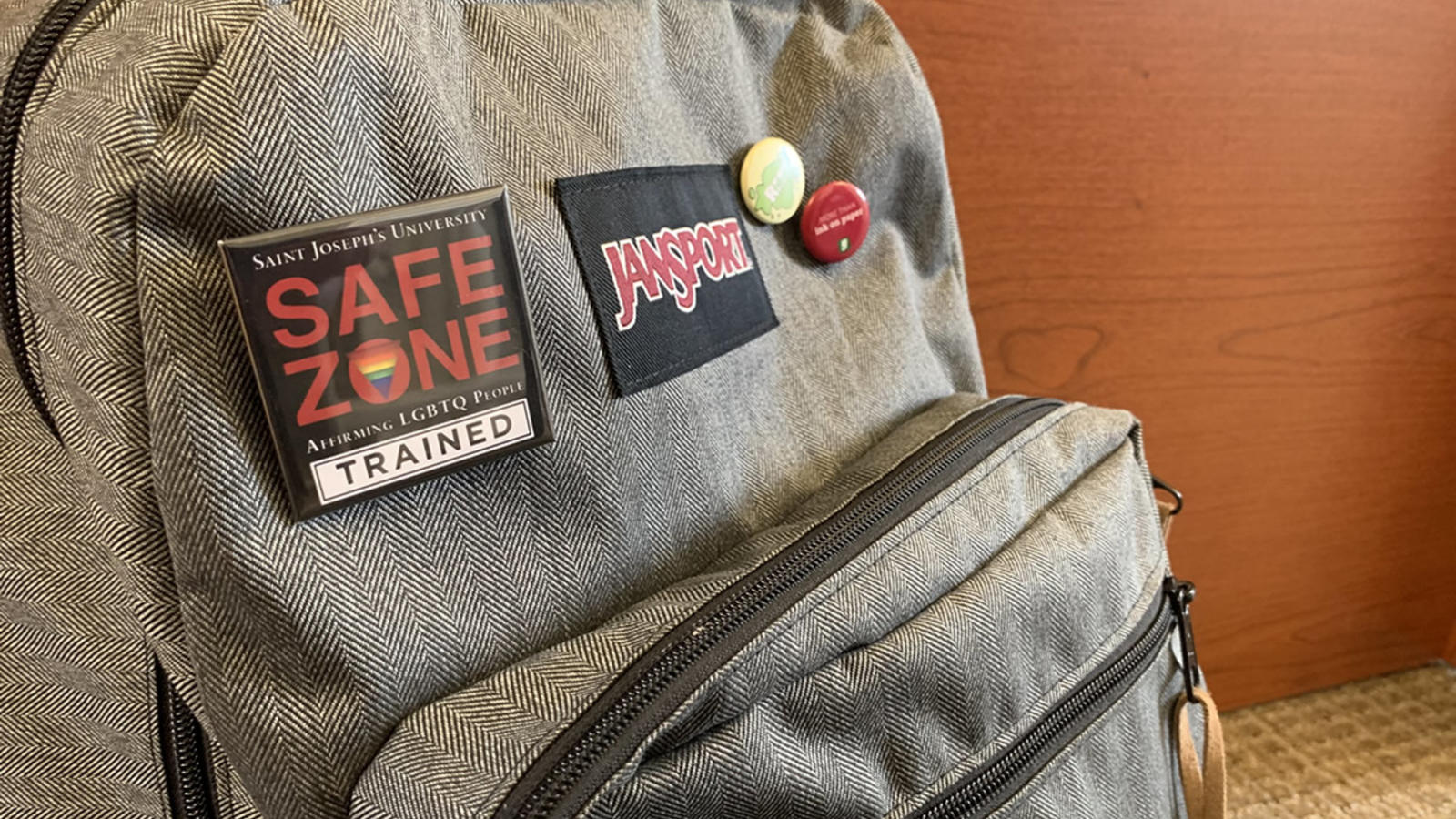 safe zone pin on backpack