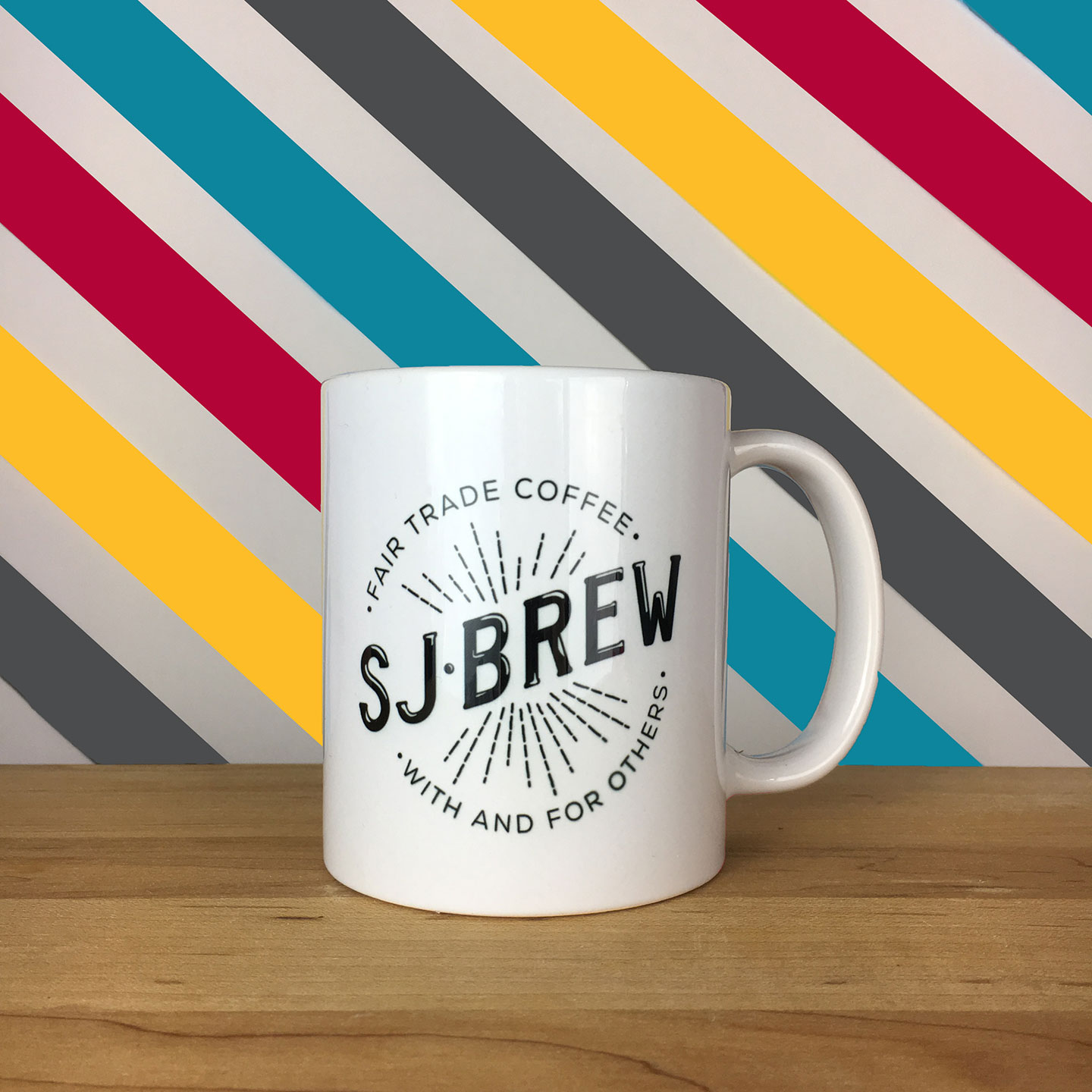 SJ Brew mug with colored stripes background