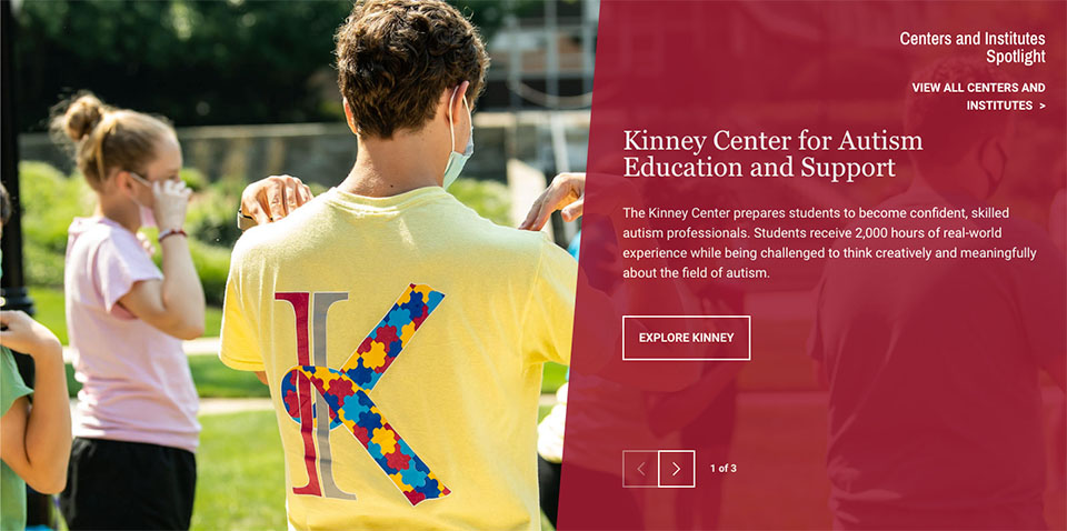 A group of children do an exercise on a green field as part of an activity with the Kinney Center at Saint Joseph's University