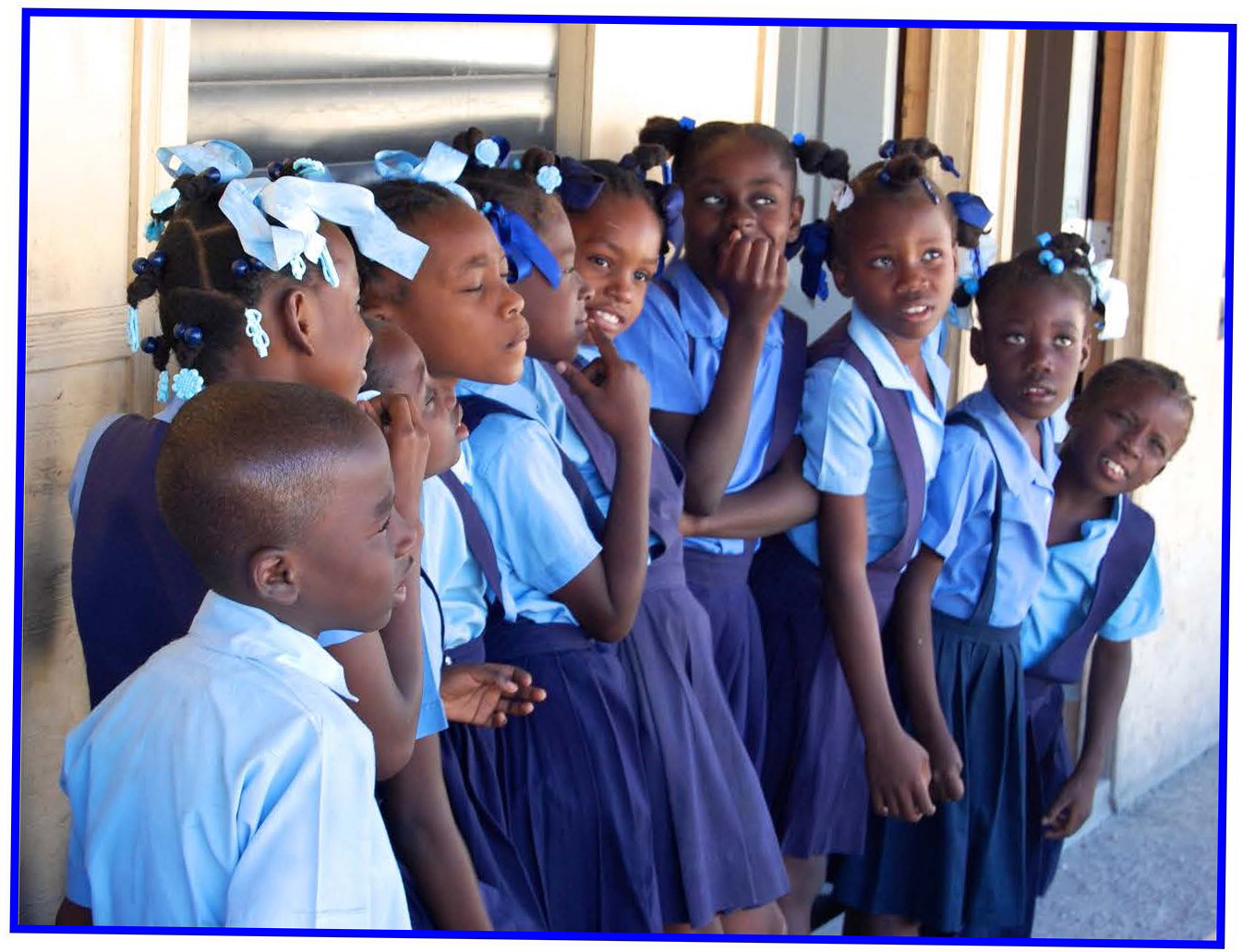 Schoolchildren dressed in blue uniforms