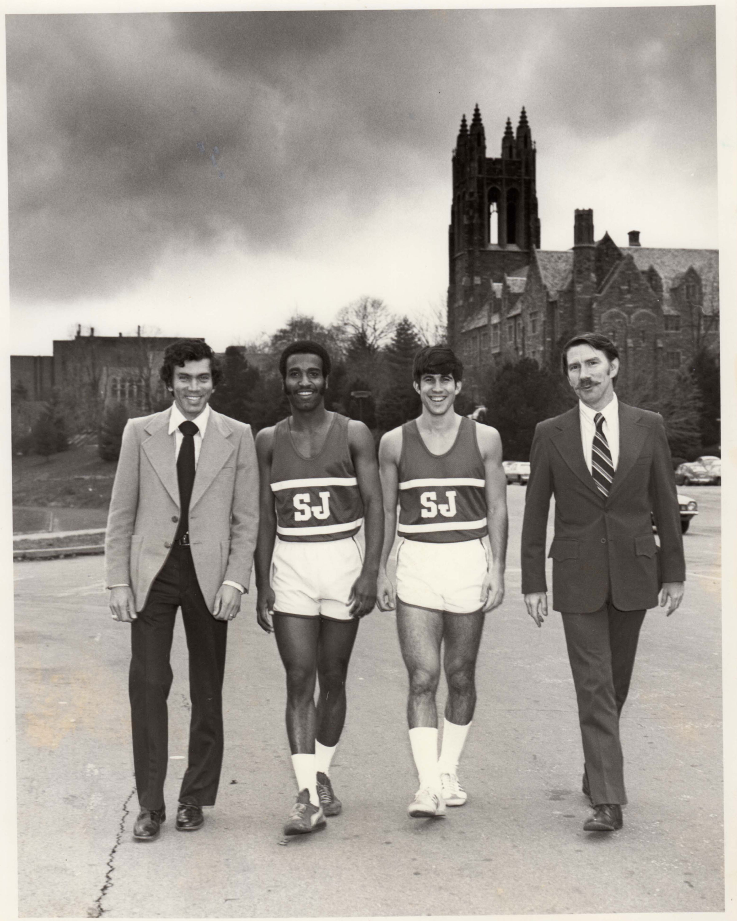 assistant coach mike diorka, co-captains euclid gibson and mike willert and head coach kevin quinn