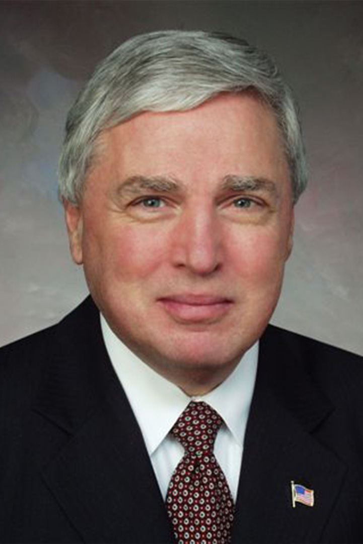 Headshot of Andrew C. von Eschenbach against a gray background