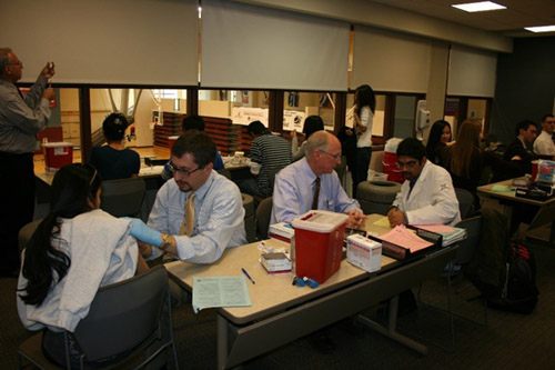 The Faculty of the Philadelphia College of Pharmacy administer H1N1 vaccinations.