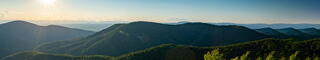 Photo of mountains and hills during a sunrise
