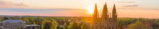 aerial shot of saint joseph's university with the sun setting in the background