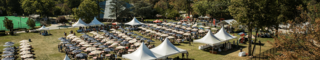 White tents covering tables on Curran Field during HawkFest 2017