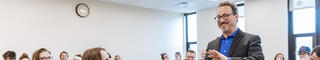 theology faculty professor teaching inside a classroom