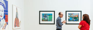Maguire Art Museum at Saint Joseph's University collection with two people standing in front of artwork