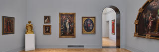 Art gallery with painting and an archway into another exhibit room at the Maguire Art Museum at Saint Joseph's Univeristy