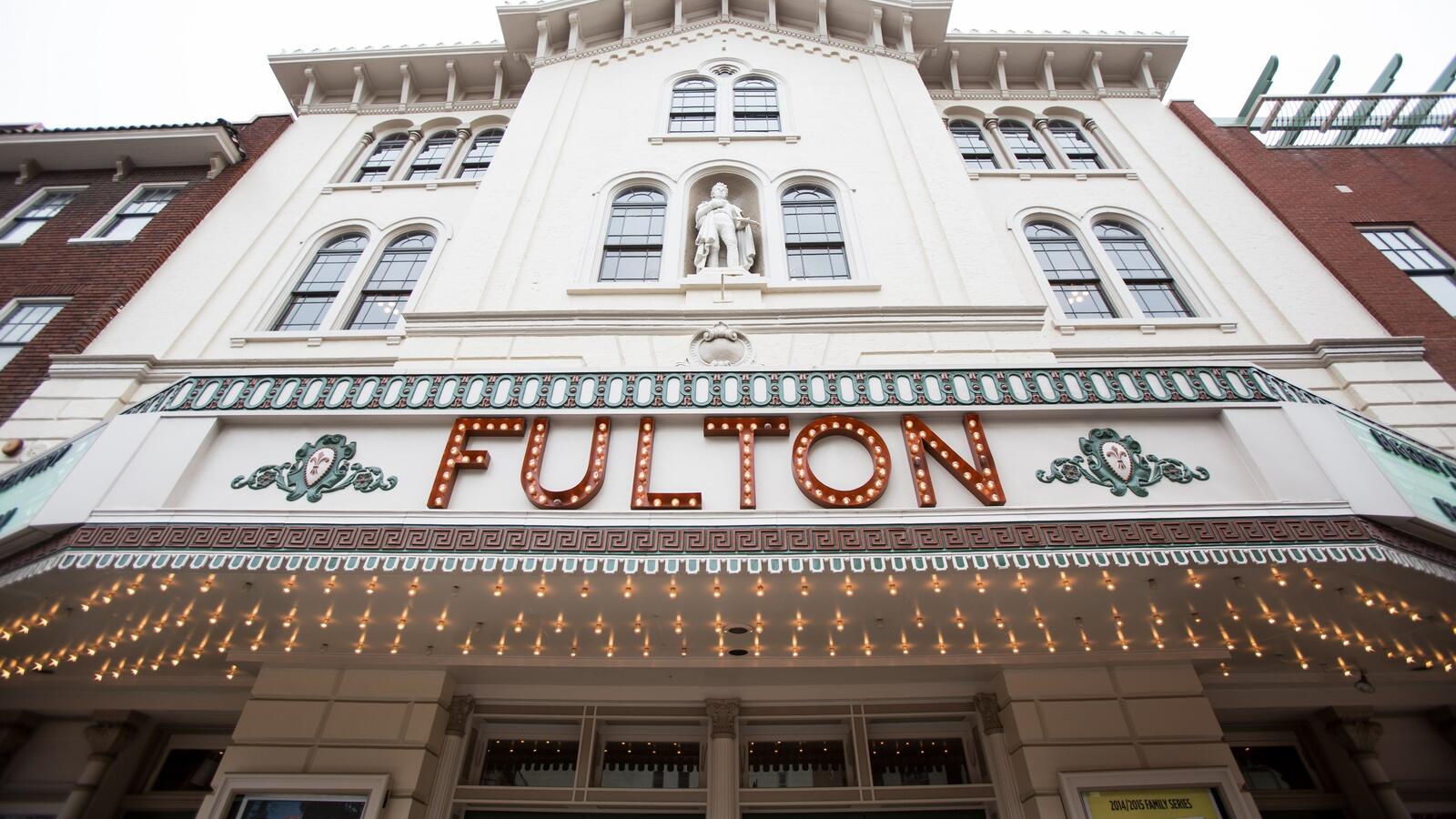 Old movie theater building that says Fulton on the marquee