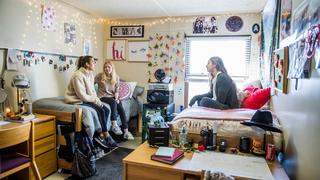 students chatting inside sourin hall dorm