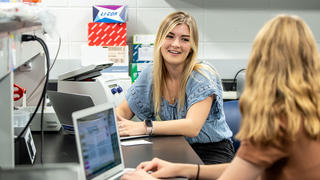 two students doing research in a lab