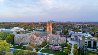 Aerial view of Saint Joseph's University campus with Philadelphia skyline in the background