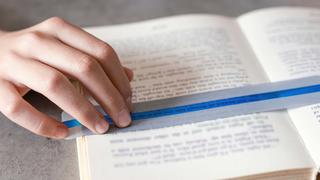 Child using tool for reading