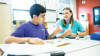 Student working with a child in the Kinney Center
